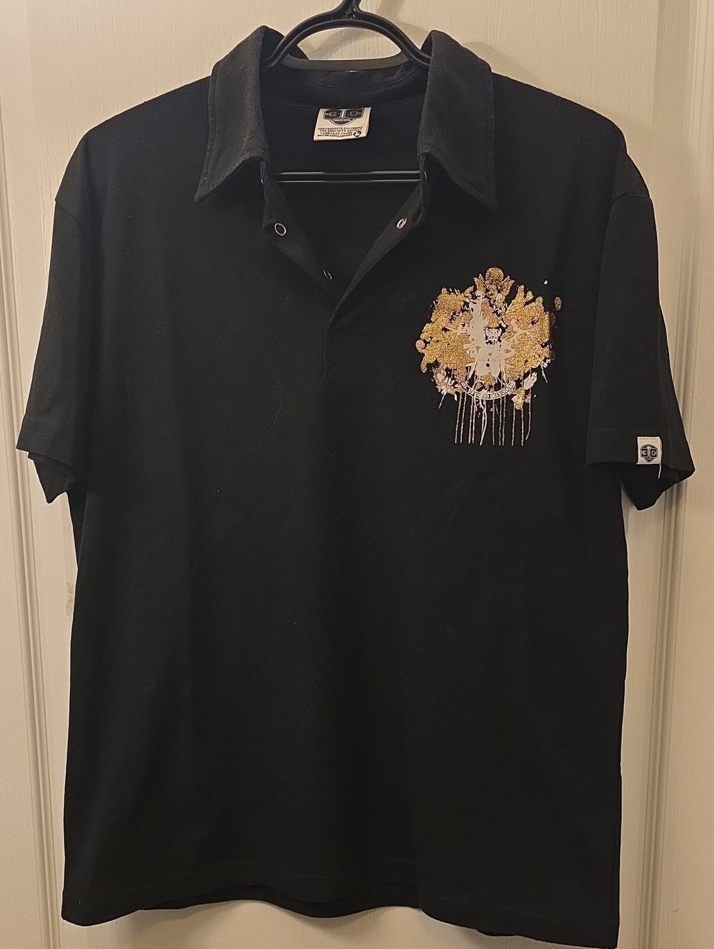Black Polo Shirt with Gold Crest Embroidery